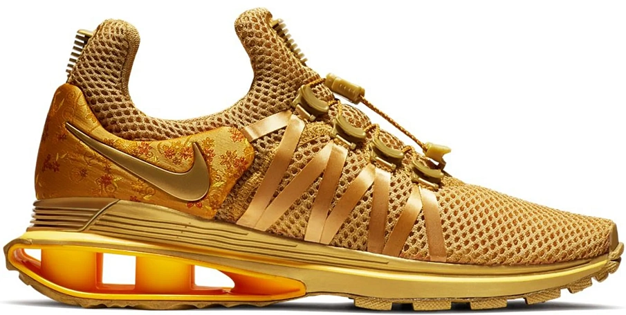 Фото № 1 с приближением к товару «‎Nike Shox Gravity Metallic Gold »